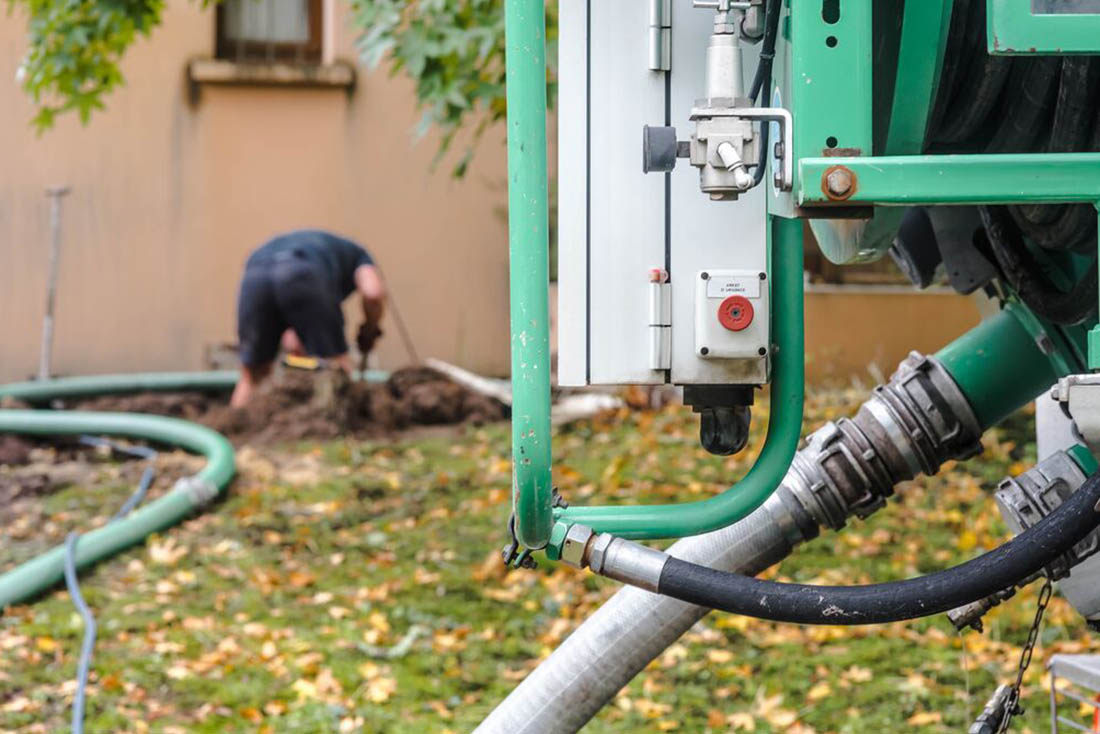 plumbing-SepticPlumbing-Supporting-1100×734 Outdoor septic system with man working in background